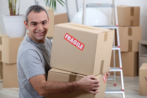 Man with van moving boxes in a Brompton street