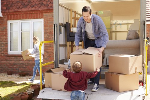 Workers and moving equipment representing ethical removals operations
