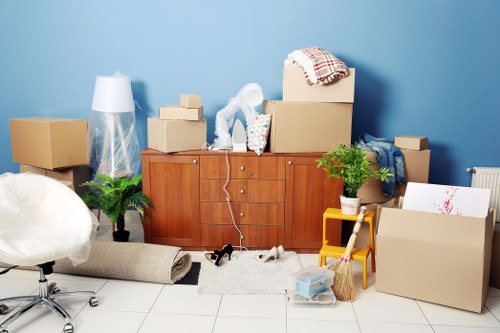 Packed moving boxes and furniture ready for house removals in Brompton