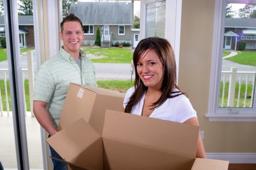Professional movers planning access and loading for a Brompton property