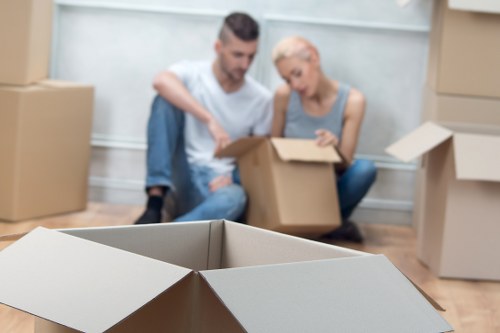 Packed office boxes and desks prepared for move in Brompton