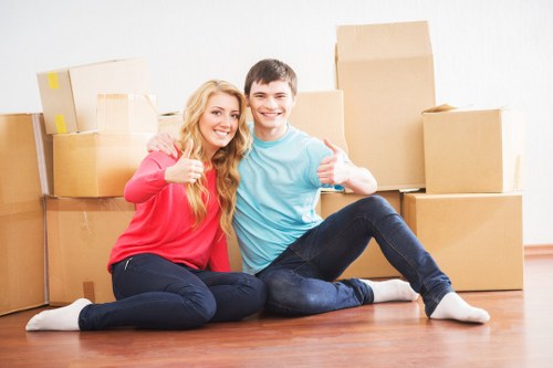 Removal team loading furniture for a load-based moving quote example