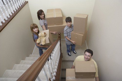 Local movers handling furniture and boxes carefully